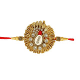 Decorative gold and red rakhi on a white background