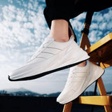 Elegant White Synthetic Leather Solid Sports Shoes For Men - Designer mart